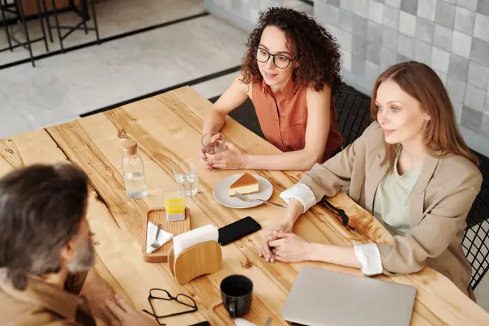A small team meeting around a table